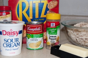 Ingredients for Chicken Casserole. Chicken, cream of chicken soup, sour cream, lemon pepper, ritz crackers, butter, poppy seeds.
